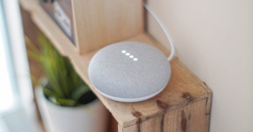 A Google Home Mini smart speaker on a wooden shelf, blending technology with home decor.