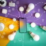 Flat lay of smart home devices and smartphone showcasing automation and connectivity.